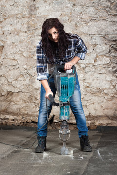 Young Long-haired Woman With A Jackhammer