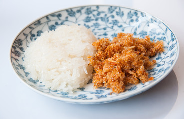 sweet sticky rice with coconut milk and sweet dried fish topping