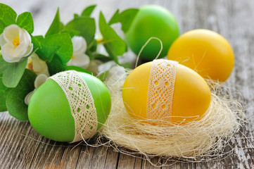Colorful Easter eggs on a wooden table old