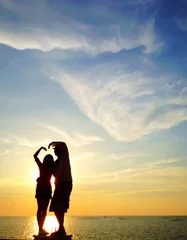 Zelfklevend Fotobehang silhouette of lover make sign of love (heart)  © sirins