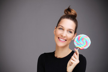 Happy woman with lollipop