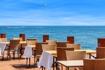Restaurant on terrace with sea view in Kemer, Turkey.