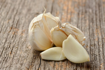 Garlic set on a wooden texture in natural light