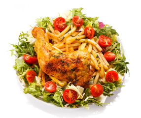 Grilled chicken leg with chips and vegetables