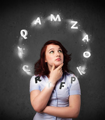 Young woman thinking with letter circulation around her head
