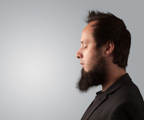 Obraz premium Young businessman thinking with copyspace