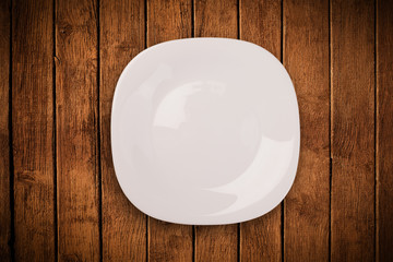 Colorful empty plate on grungy background table