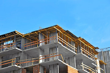 Building construction site work against blue sky