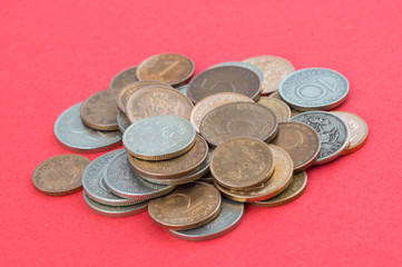 A pile of coins with red background