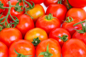 Fototapeta na wymiar group of red-orange tomatoes put in several row