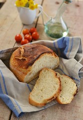 Home-made bread with vegetables on a wooden table