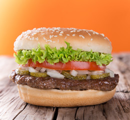 delicious hamburger on wood