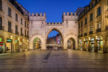 Naklejka premium Karlstor Gate and Karlsplatz Square in the Evening, Munich, Germ