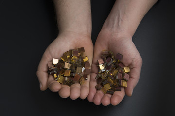 Handful of gold tiles