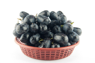 Red grapes in plastic basket