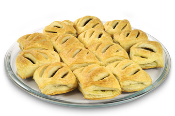 Homemade pasties with meat on glass plate