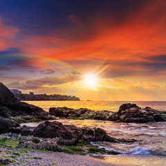 sea wave breaks about boulders
