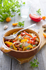 Ragout from turkey and tomato and sweet peppers