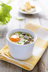 Healthy lunch: baked egg with mashrooms and chive