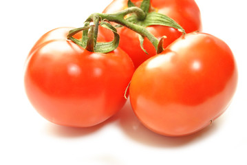 Perfect Red Tomatoes Isolated Over White