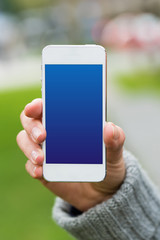 smartphone holding by woman's hand