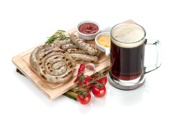 Grilled sausages with ketchup, mustard and mug of beer