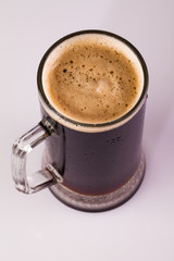 Frosty glass of dark beer