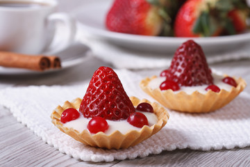 Two delicious fresh strawberry tarts horizontal. close-up