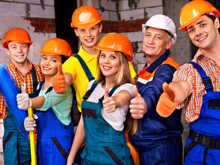 Group people in builder uniform.