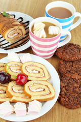 Cup of cappuccino and sweets close up