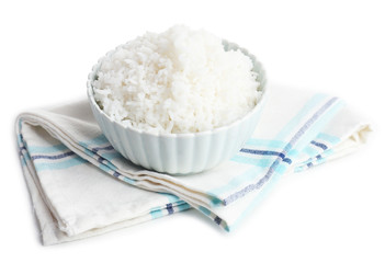 Cooked rice in bowl on napkin close up