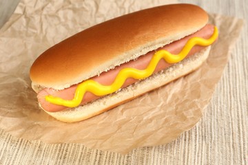 Tasty hot dog on paper