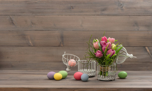pastel colored tulip flowers and easter eggs
