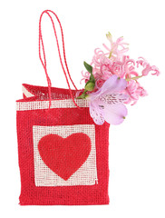 Gift bag with flowers isolated on white