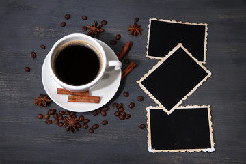 Coffee cup and old blank photos and spices, on wooden