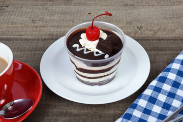 Chocolate cake with cherry.