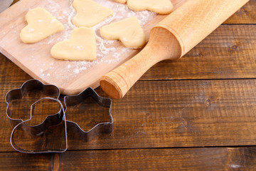 Making cookies on wooden background