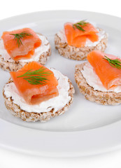 Delicious canapes on plate close-up