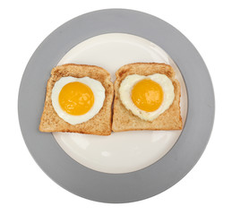Scrambled eggs with bread on plate, on color napkin