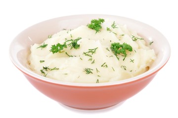 Delicious mashed potatoes with greens in bowl isolated on white