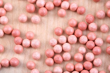 Powder balls on wooden background