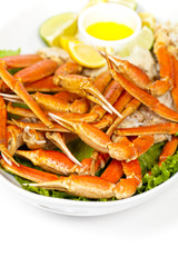 Crab legs with fresh lemon and butter sauce. Selective focus