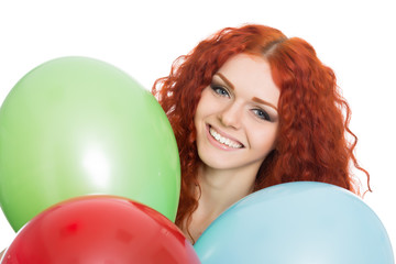 Young woman holding colorful balloons