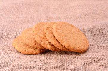 Freshly baked home made cookieson sackcloth background