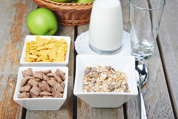 Tasty breakfast of muesli, fresh milk and apples