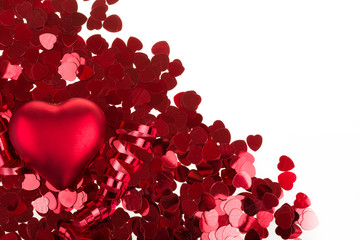 small red confetti and big hearts on white background
