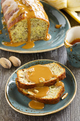 Banana bread with caramel sauce and pecans.
