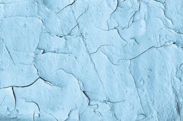 cracked surface of blue wall