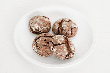 Chocolate crinkles cookies with coffee, white background