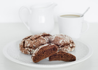Chocolate crinkles cookies with coffee, white background